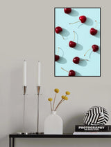 Cherries on turquoise background Poster och Canvastavla