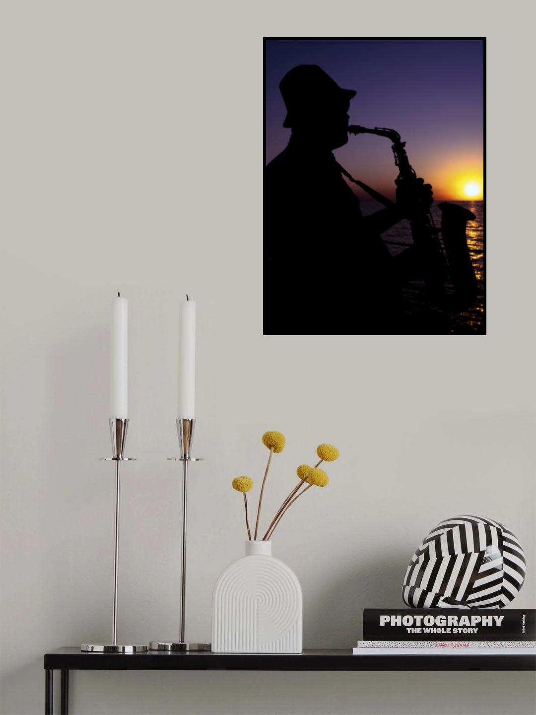 a musician playing the saxophone at sunset Poster och Canvastavla