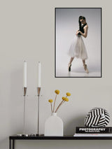 The coquetry. a young ballerina in a black skirt and Chopin is standing on pointe shoes Poster och Canvastavla