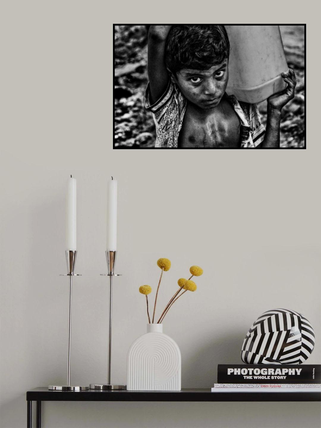 Refugee child carrying a container of water Poster och Canvastavla