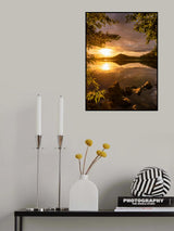 Sunset at a lake with a small mountain in the background Poster och Canvastavla