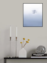 Small tree on hil during misty weather with snowfall Poster och Canvastavla