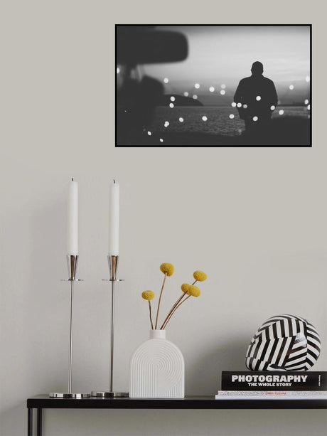 Silhouette traveler on the background of the water in evening Poster och Canvastavla