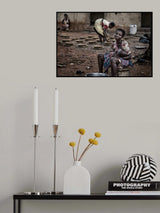 A break in the making of pottery to breastfeed her child - Ghana Poster och Canvastavla